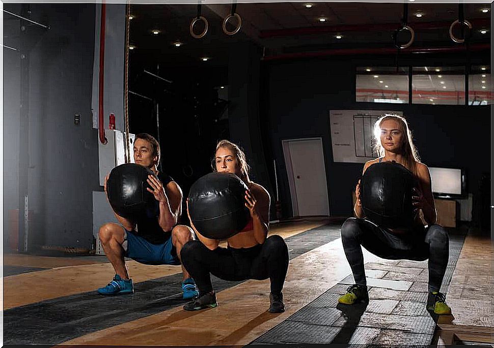 squat on an exercise ball