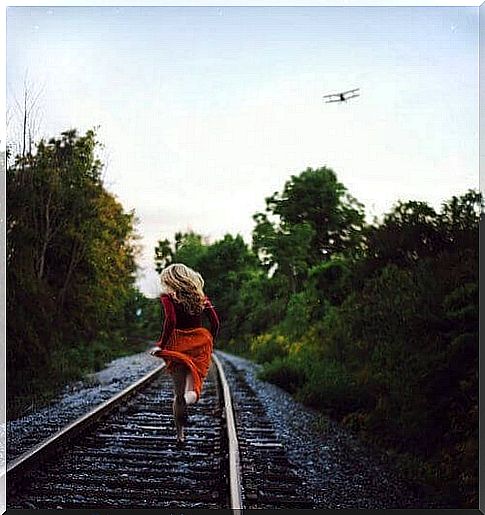 woman running on a railway